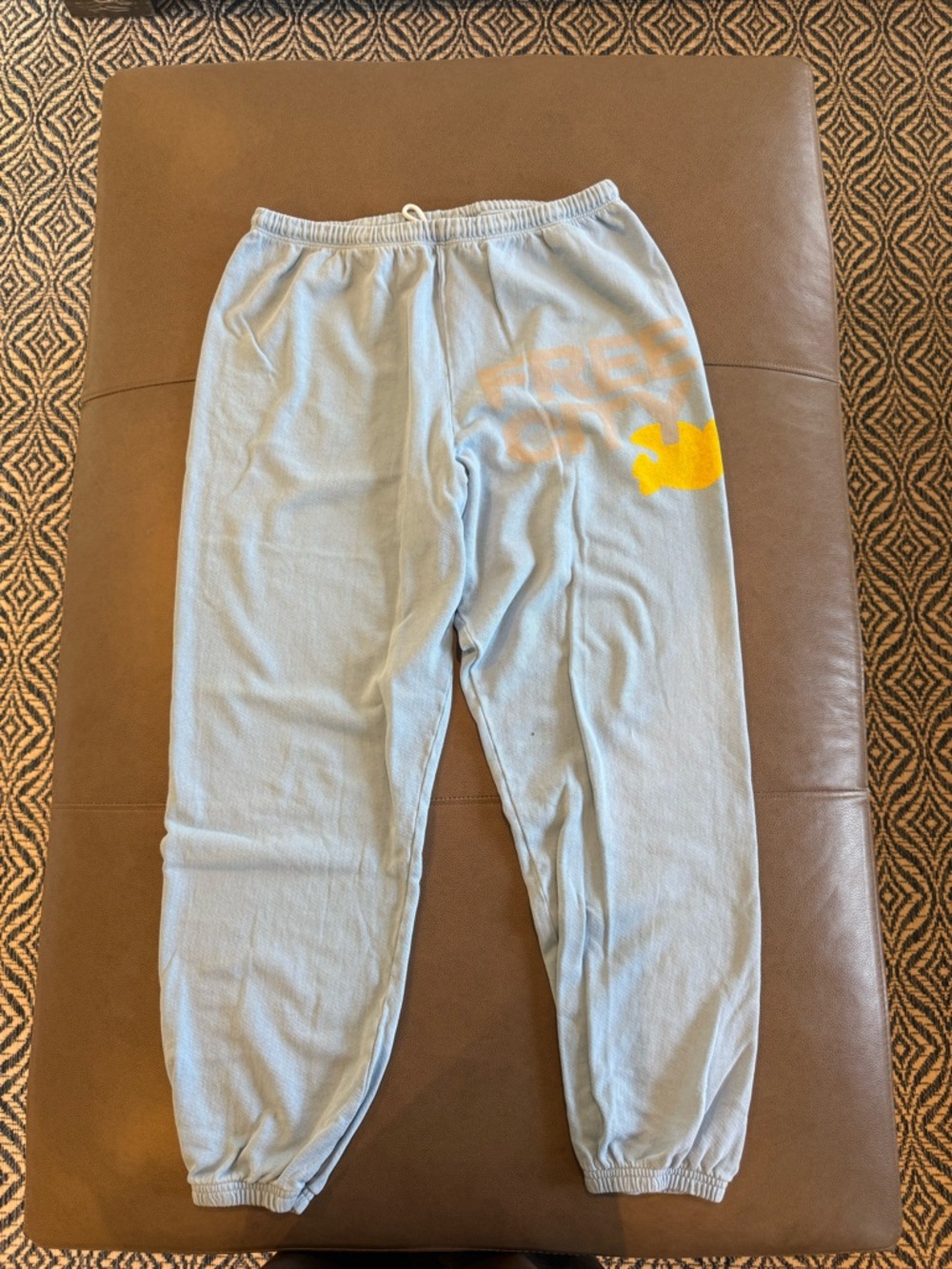 freecity Light Blue Track Pants with Yellow Graphic